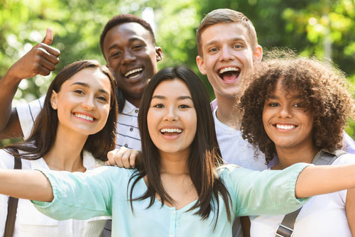 A Fun Group Of Multi-ethnic Teen Friends Taking Selfie