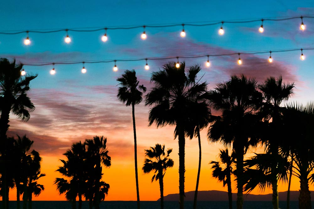 Colorful,Sunsets,With,Silhouetted,Palm,Trees,In,Foreground,String,Lights,In,California