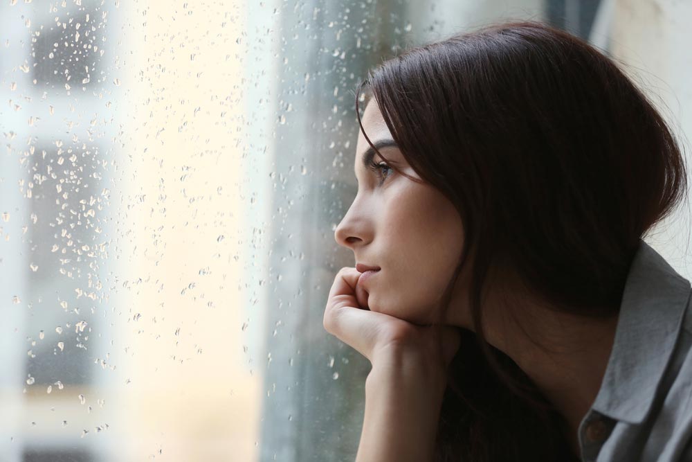 Depressed,Young,Woman,Near,Window,At,Home,,Closeup