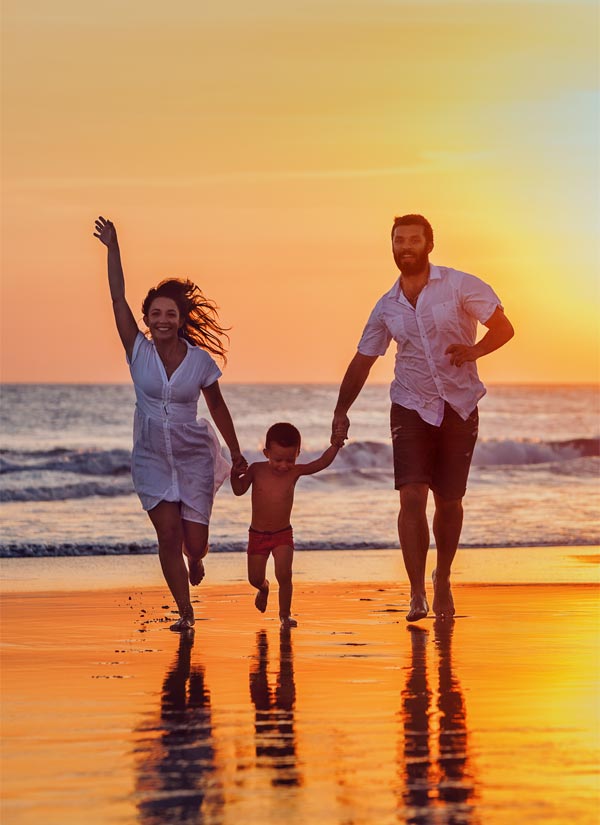 happy family walking on the seaside