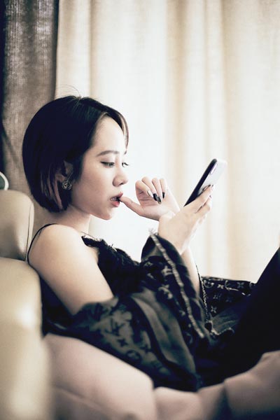 a woman addicted to social media
