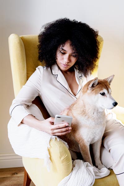 beautiful lady with a dog addict to social media