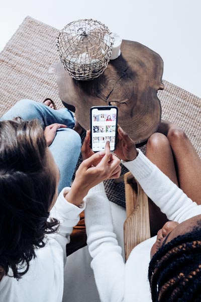 two female friends looking at social media