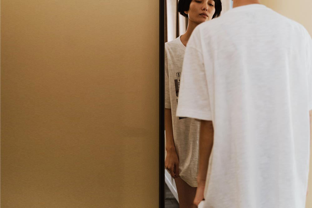 a woman with anorexia looking at the mirror