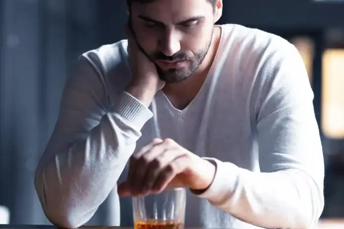 Upset Young Man Drinker Alcoholic Sitting At Bar Counter