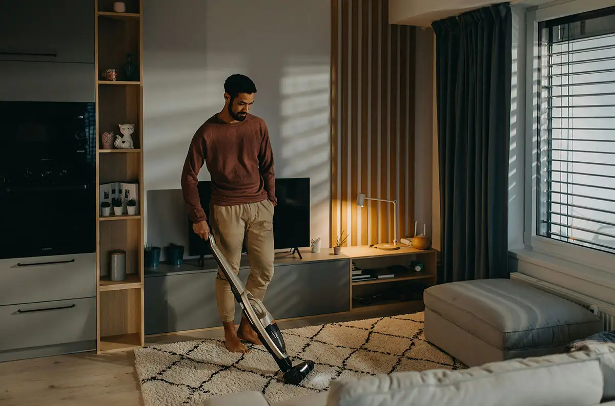 man cleaning his house Actively Improving his Space and Life