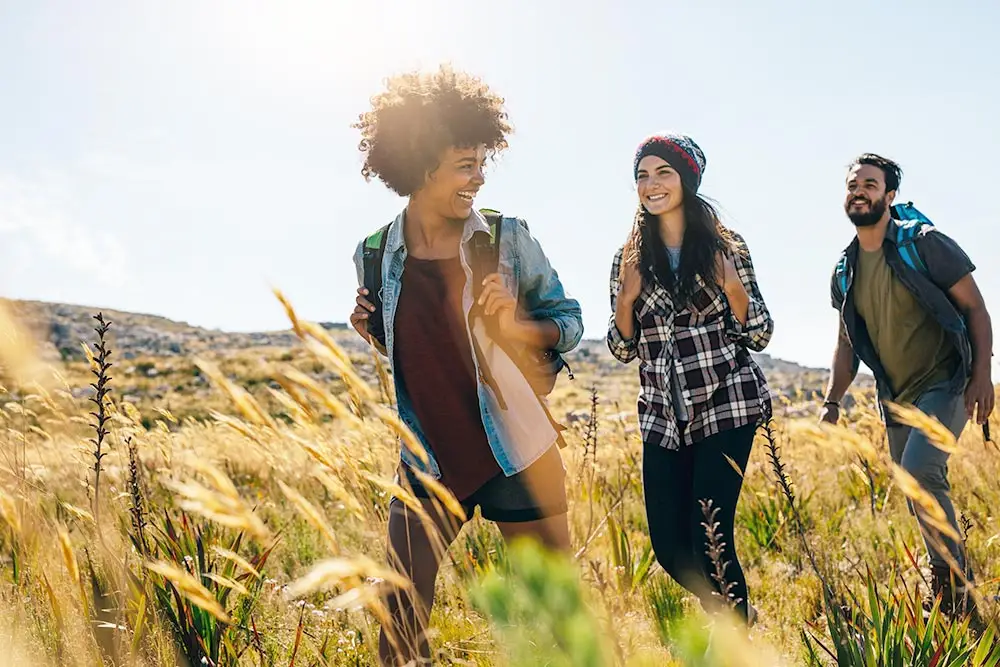 2 women and a man during hiking as part of the aftercare program