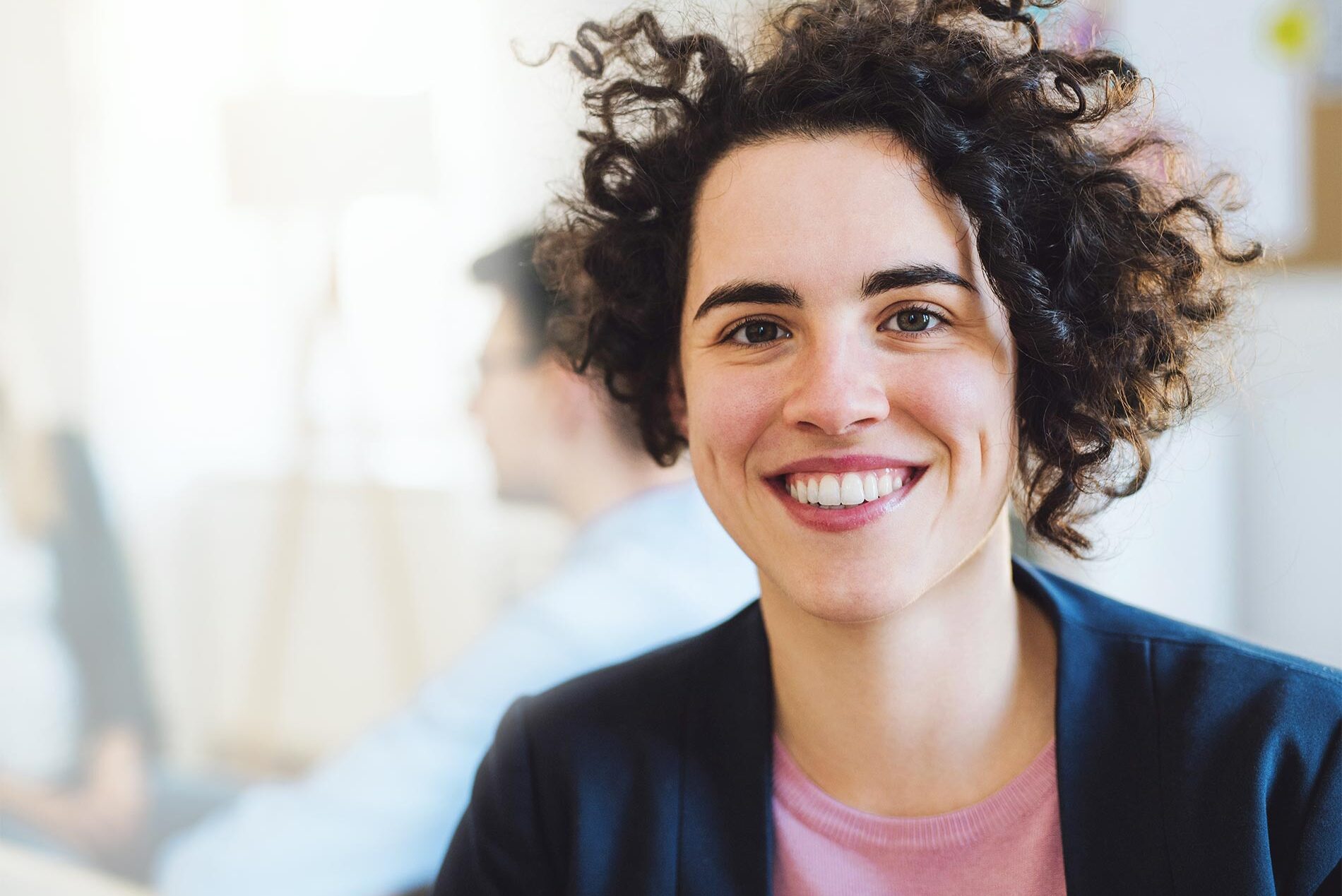 Happy woman smiling for the camera from an effective drug and alcohol rehab center in California