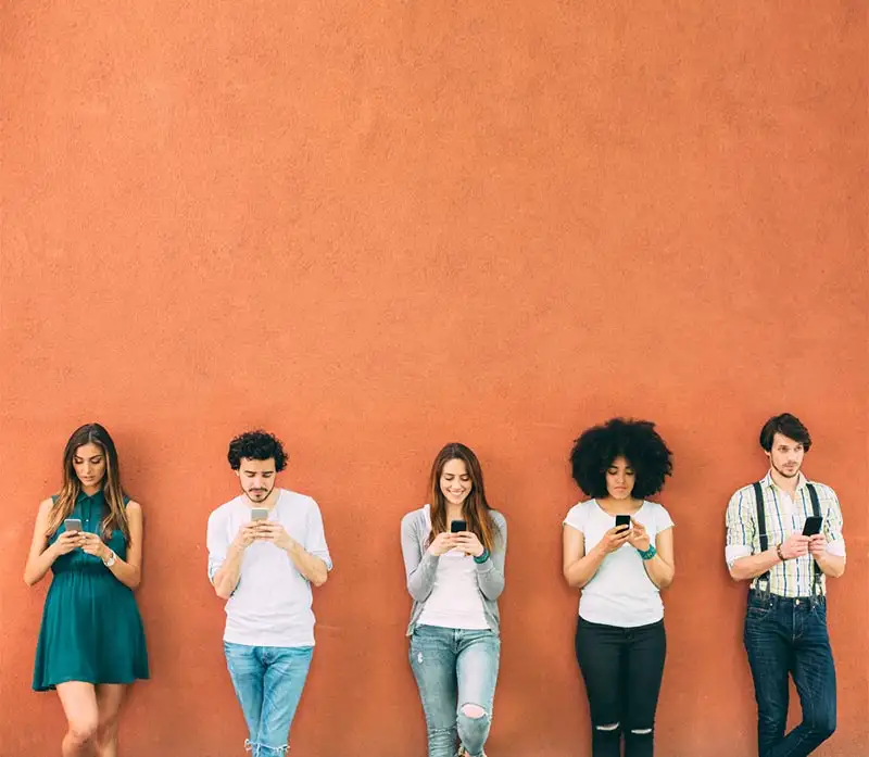 young men and women using their mobile phones Social Media Addiction concept