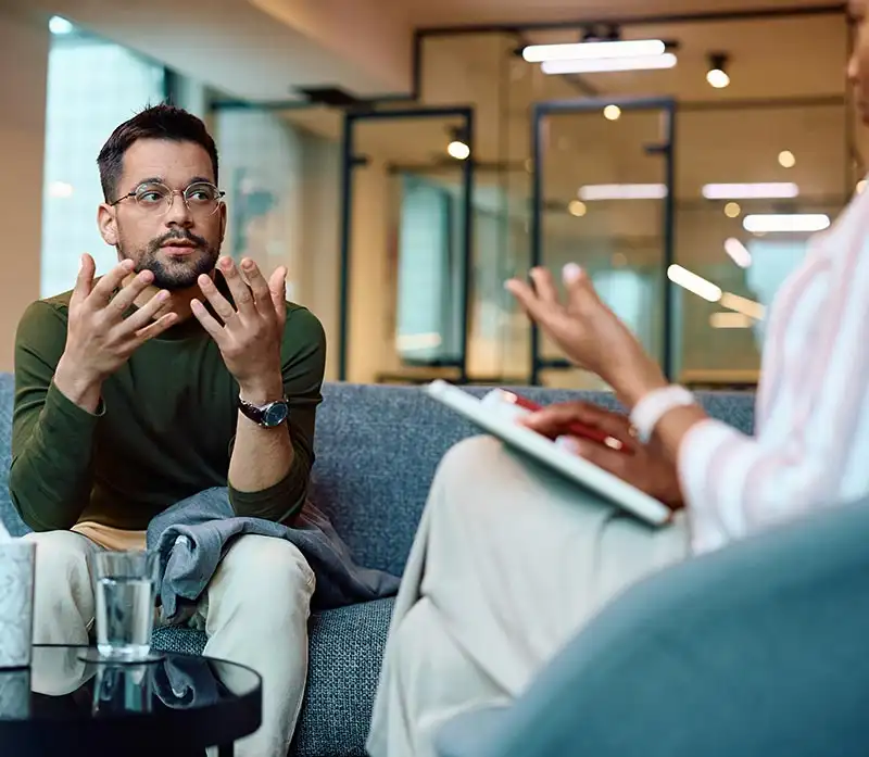 a man and a psychologist during Obsessive-compulsive disorder (OCD) treatment