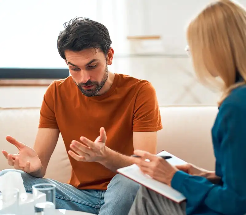 a man during and female psychologist during Opioid abuse treatment