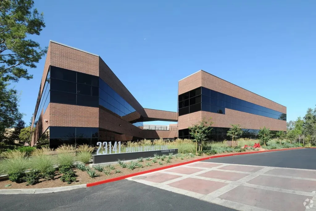 Exterior of Compassion Recovery Centers in Laguna Hills, featuring a modern brick professional building at 23141 Moulton Parkway in Orange County.