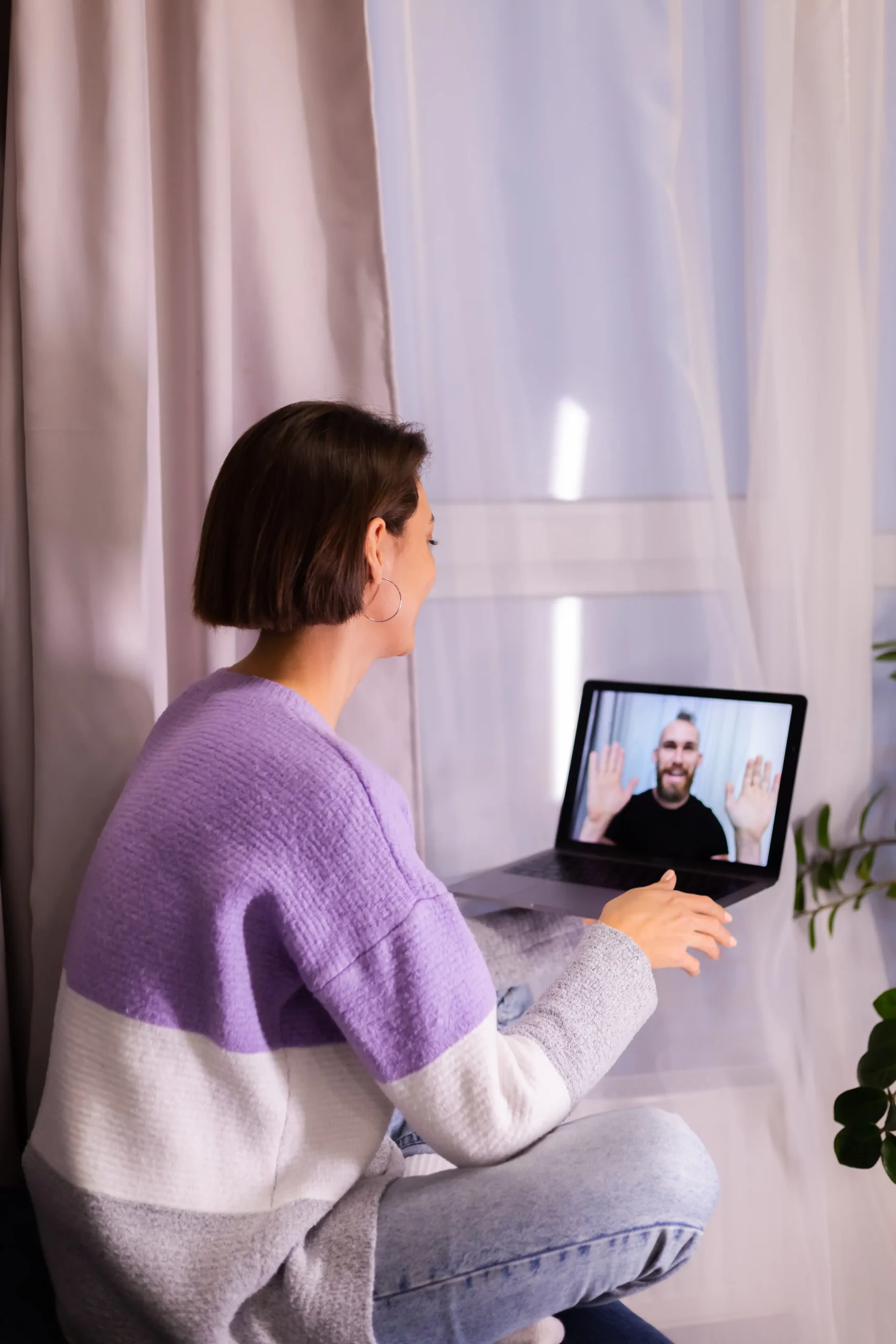 A woman in Laguna Hills connecting with a California-licensed therapist via a secure virtual mental health platform.