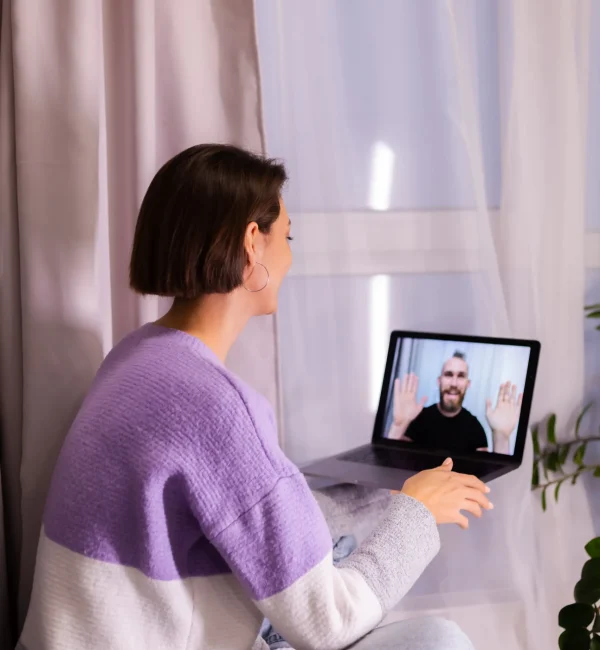 A woman in Laguna Hills connecting with a California-licensed therapist via a secure virtual mental health platform.